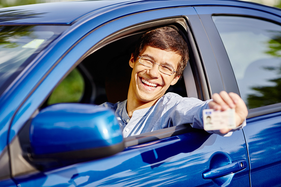 boy in blue car passed test